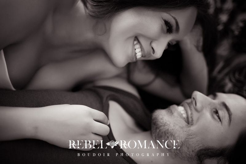 Couples Boudoir Photography Rebel & Romance Boudoir London_033 happy laughing couples photography close up of smiling faces in black and white during a couples boudoir shoot London
