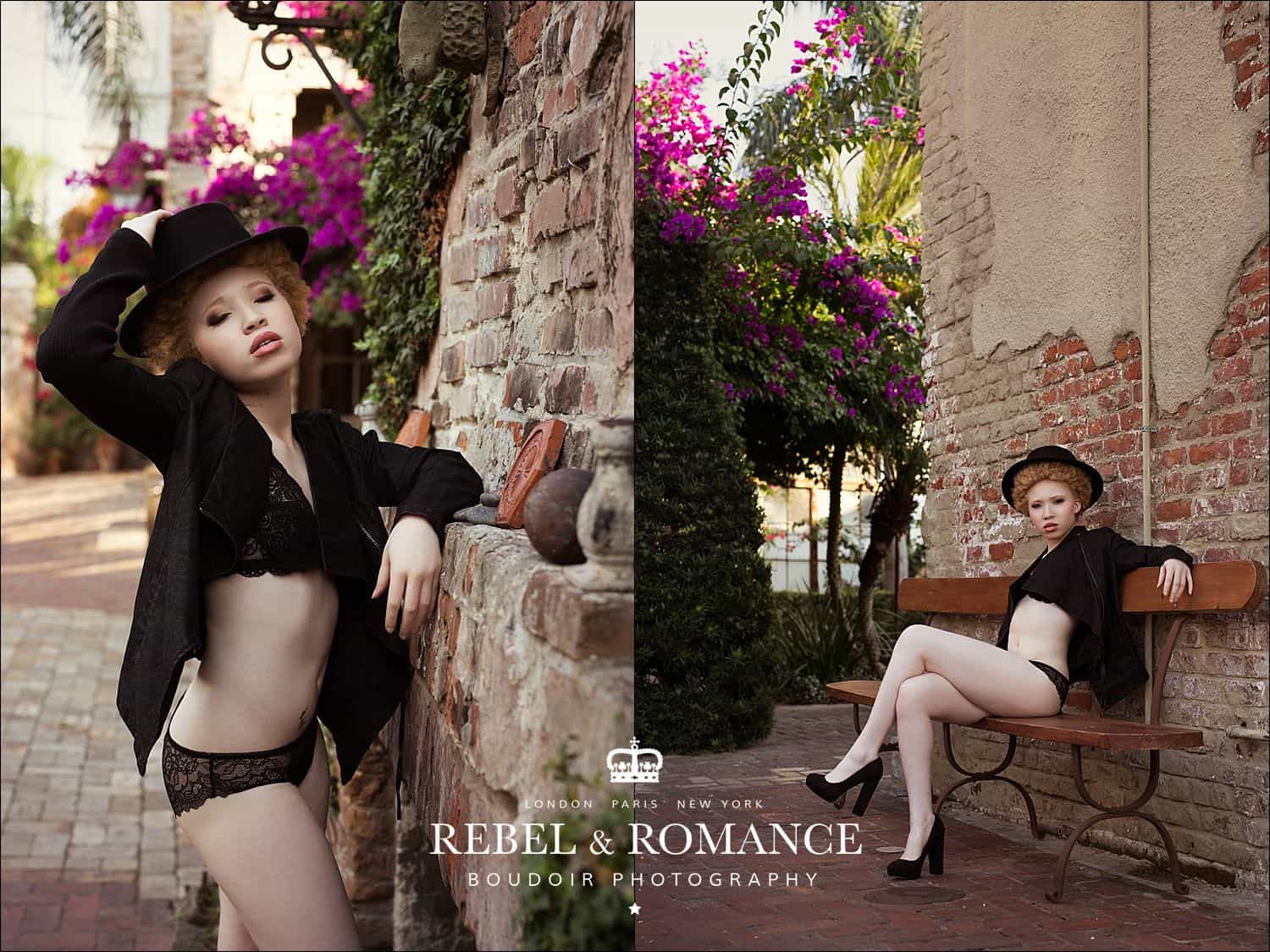 albino woman with afro wearing lingerie and a hat in front of a brick wall