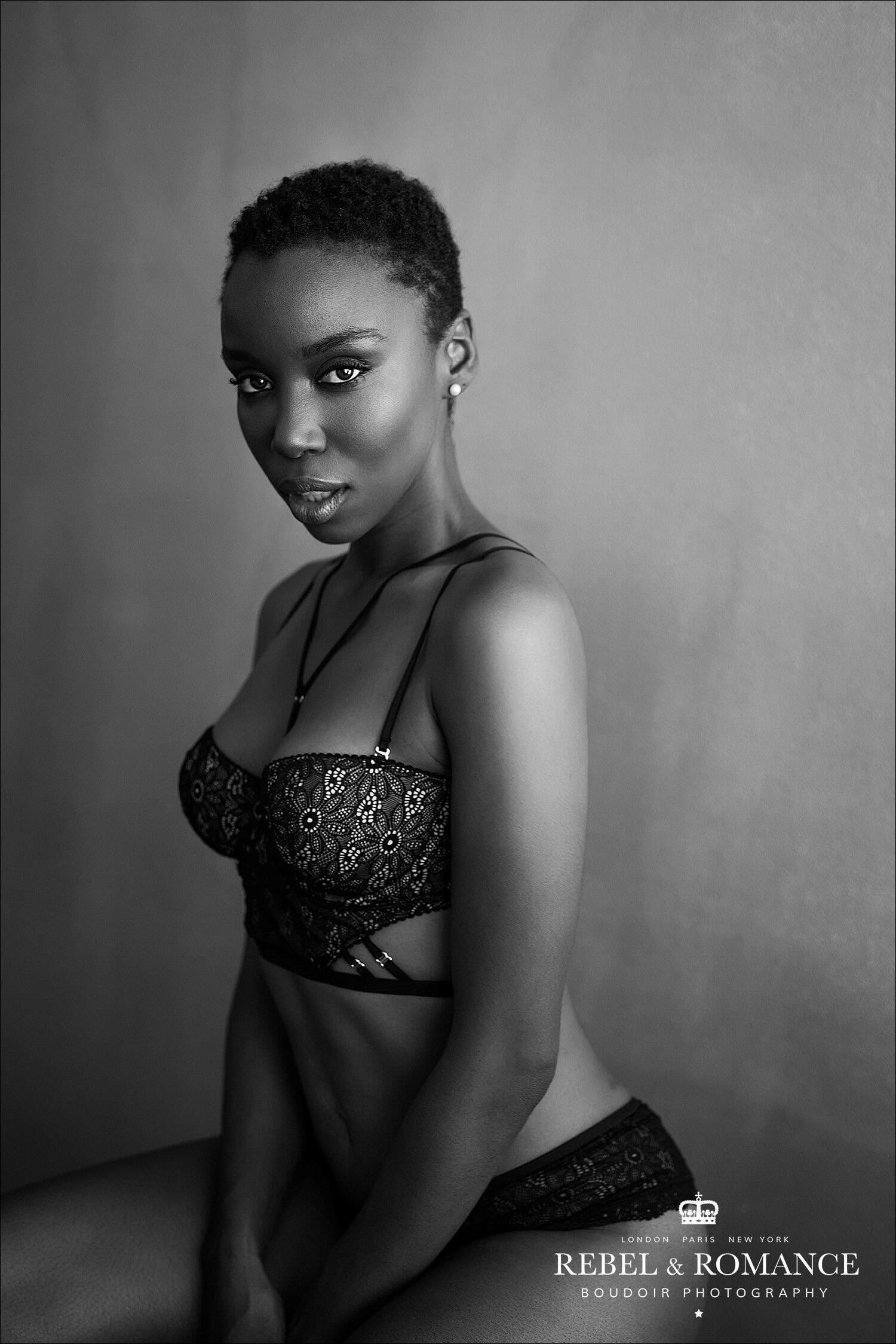 black and white portrait of woman with shaved hair