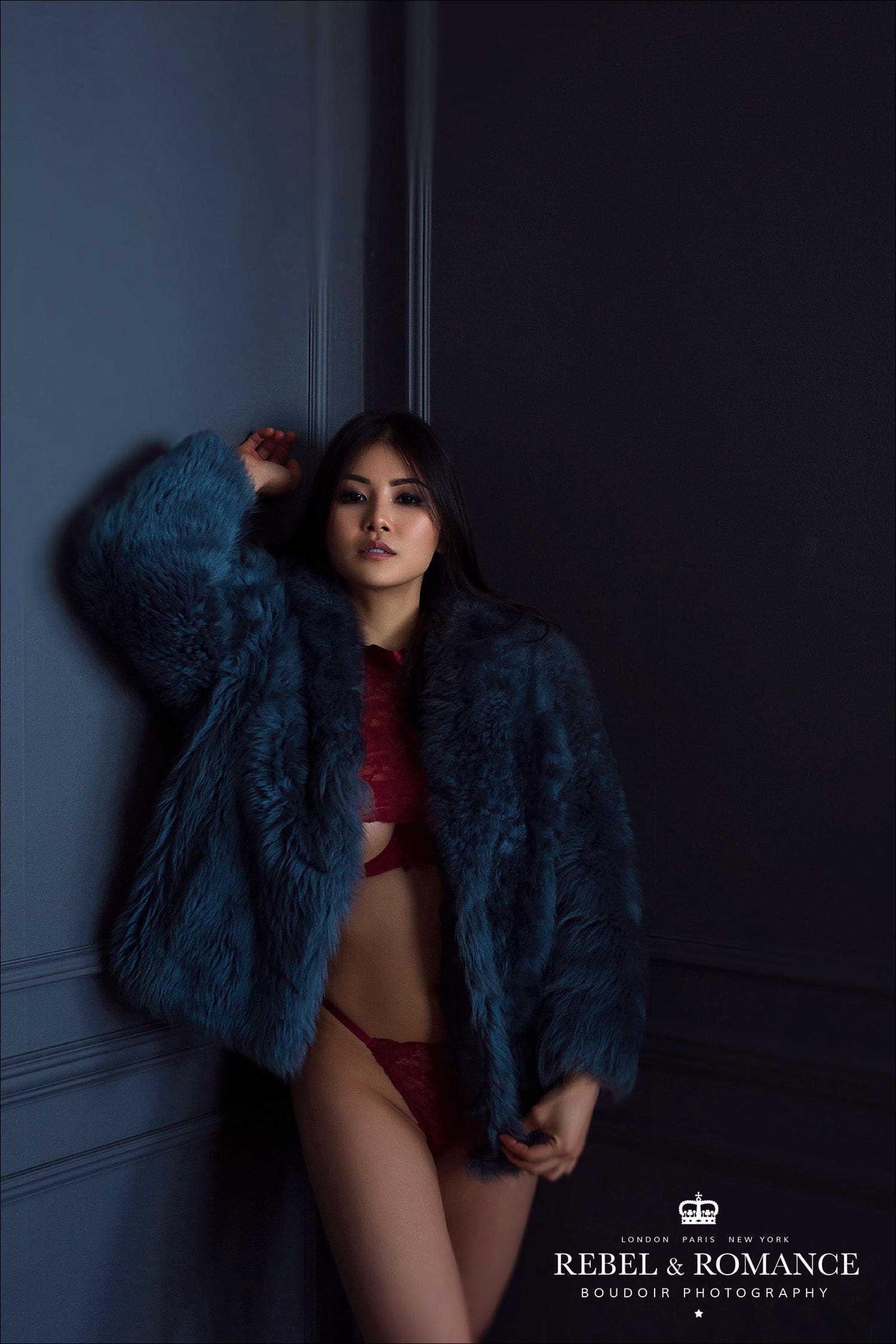 chinese model wearing red lingerie during glamour photo shoot in london