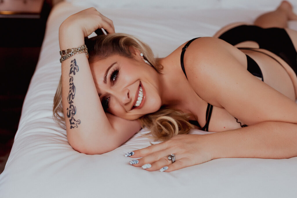 Confident boudoir photoshoot after weight loss featuring a woman in lingerie