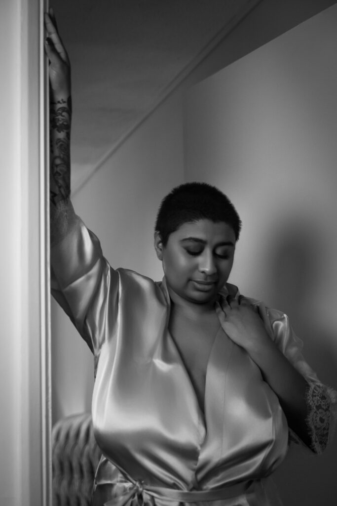 Sensual boudoir photography in Suffolk, woman in champagne silk robe