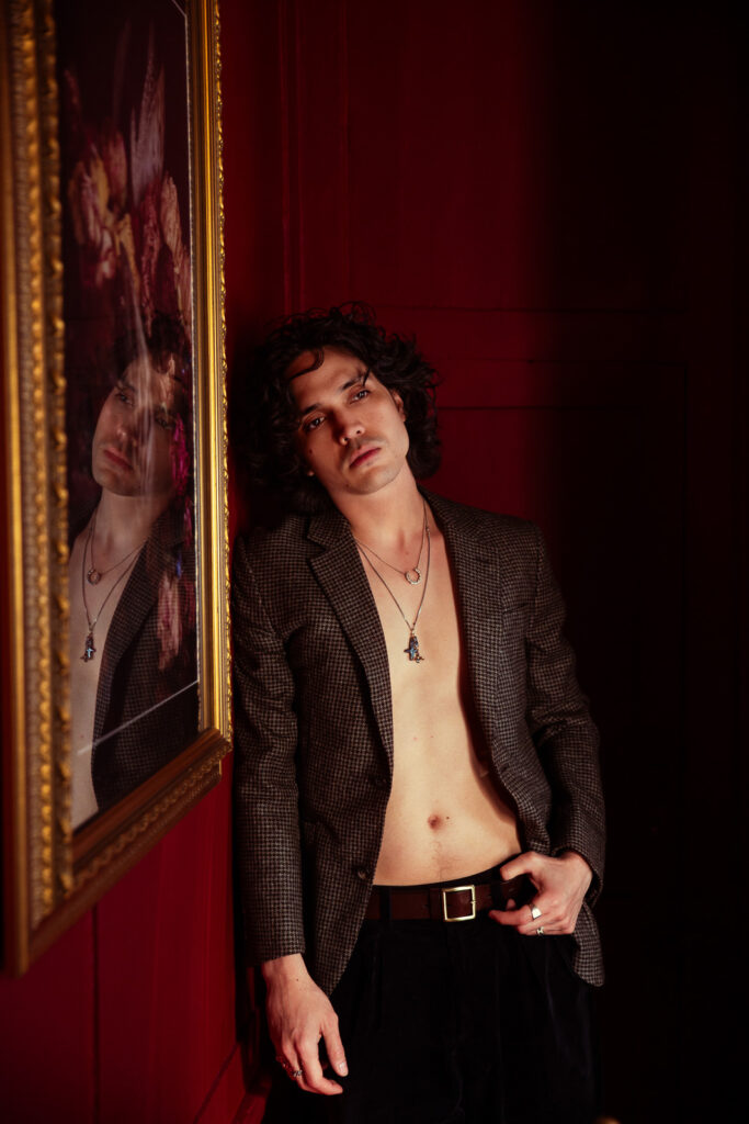 Andrew in dark suit jacket, editorial portrait during London couples photoshoot