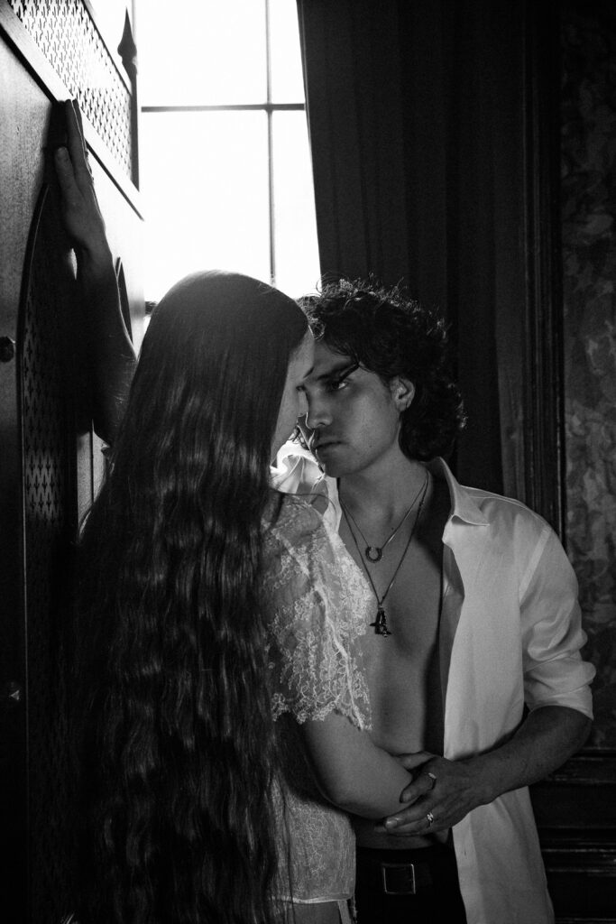 Intense gaze, couple by the window, romantic couples photoshoot London