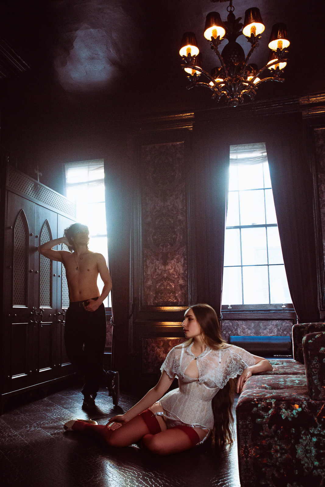 Silhouette of couple by in a dramatic room, romantic couples photoshoot London