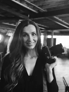 bio candid self portrait of a couples boudoir photographer in london, woman holding camera
