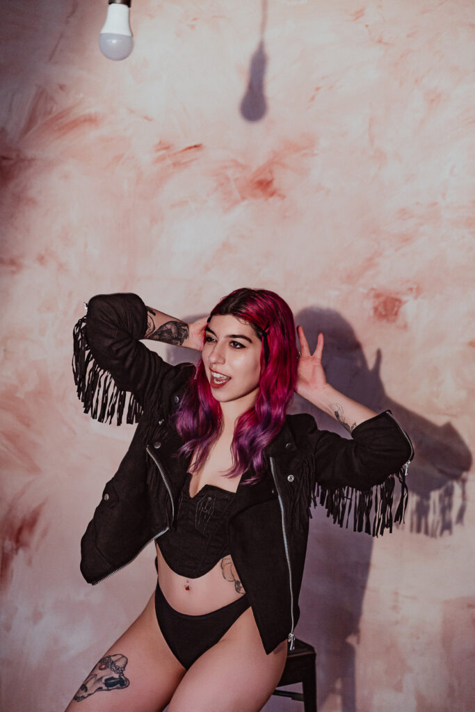London warehouse boudoir photographer, industrial setting and fringe jacket