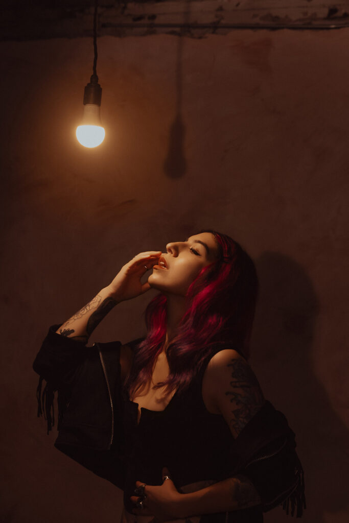 Atmospheric warehouse boudoir shoot London, bare bulb light
