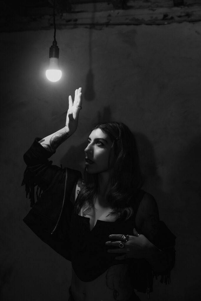Atmospheric black and white warehouse boudoir shoot London, witchy and moody