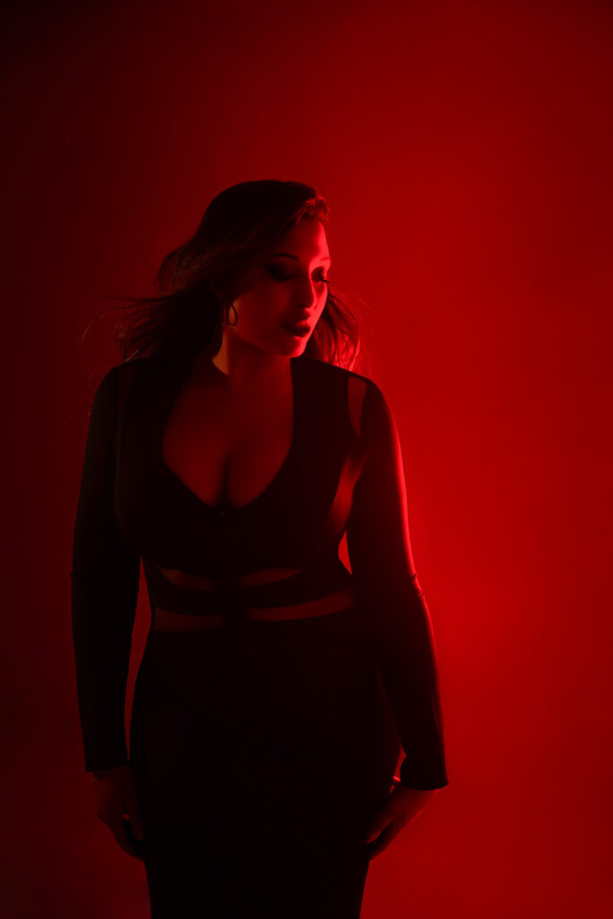 photoshoot of a woman with RGB light and red backdrop, London studio