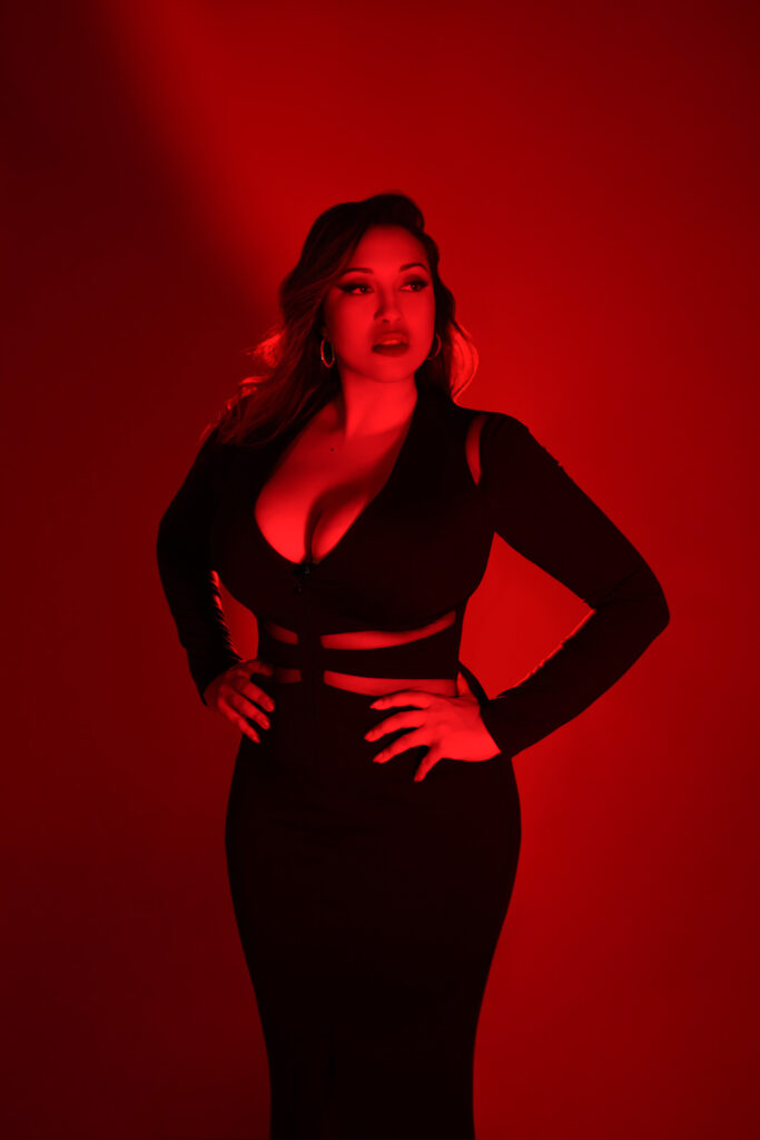 Editorial boudoir portrait, red backdrop and all red lighting